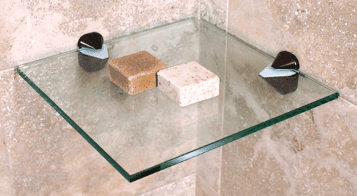 Tempered glass shelf mounted on a wall with beveled edges