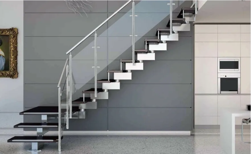 Modern staircase featuring custom glass railing, showcasing tempered glass and sleek design elements for a stylish interior.