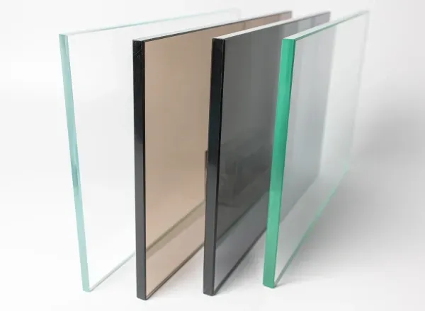 Tempered glass sheets showcasing clear, tinted, and beveled edges for shower doors, table tops, and custom mirrors.