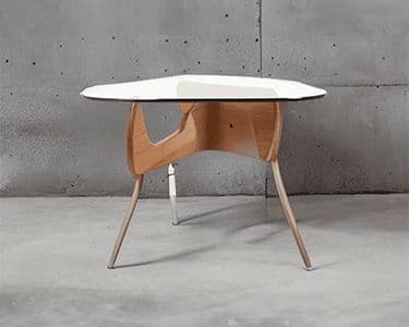 Custom glass table top with a unique shape and wooden base, showcasing modern design and craftsmanship, ideal for home decor.