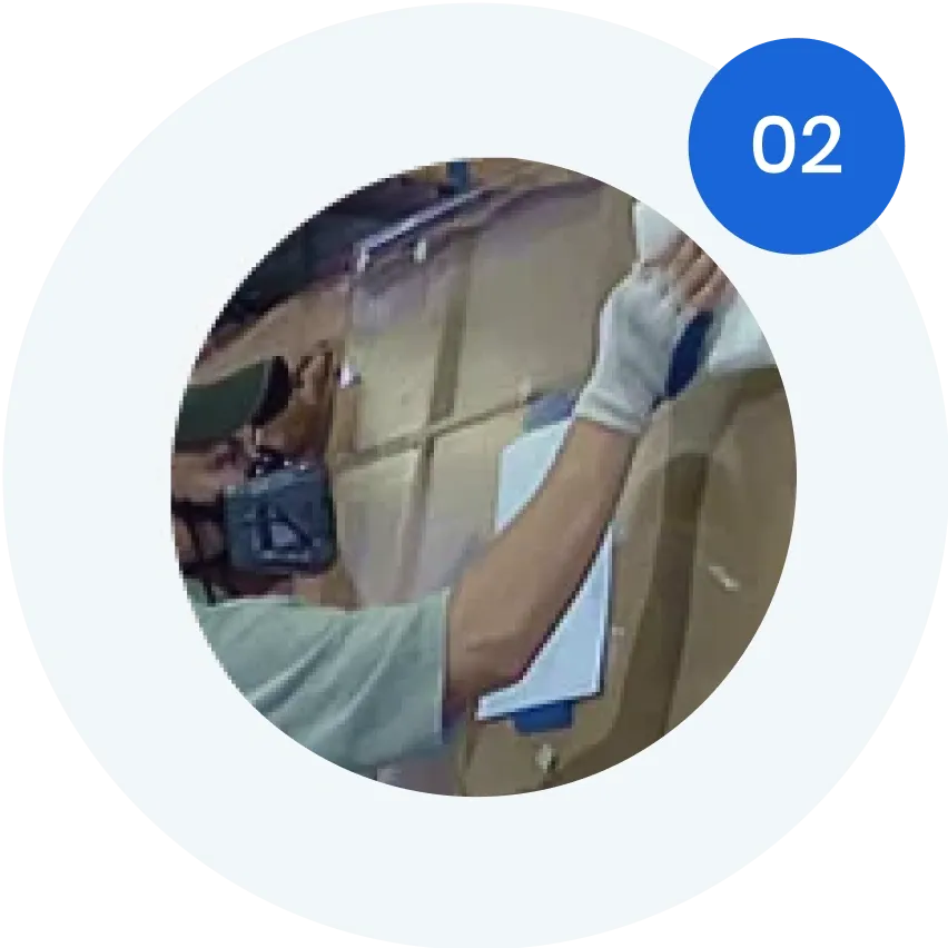 Worker applying finishing touches to custom glass products, including tempered glass and beveled glass edges for shower doors, table tops, and mirrors.