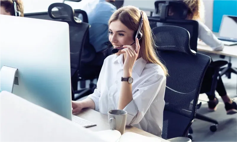 Customer service representative assisting clients with inquiries about custom glass solutions, including shower doors, table tops, mirrors, and various glass types like tempered and beveled edges.