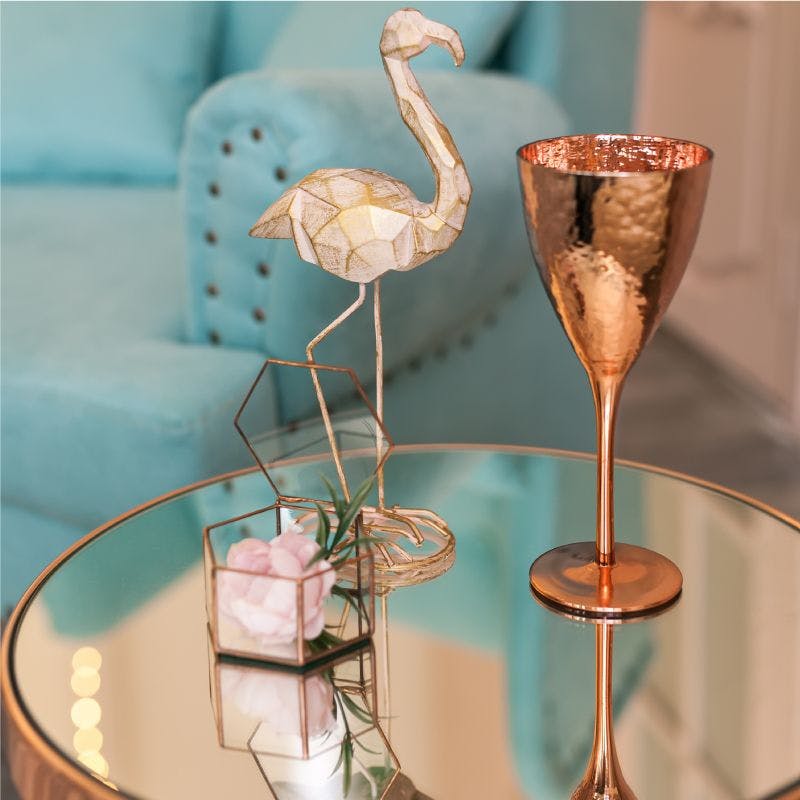 Mirrored coffee Table with flamingo and glass vase