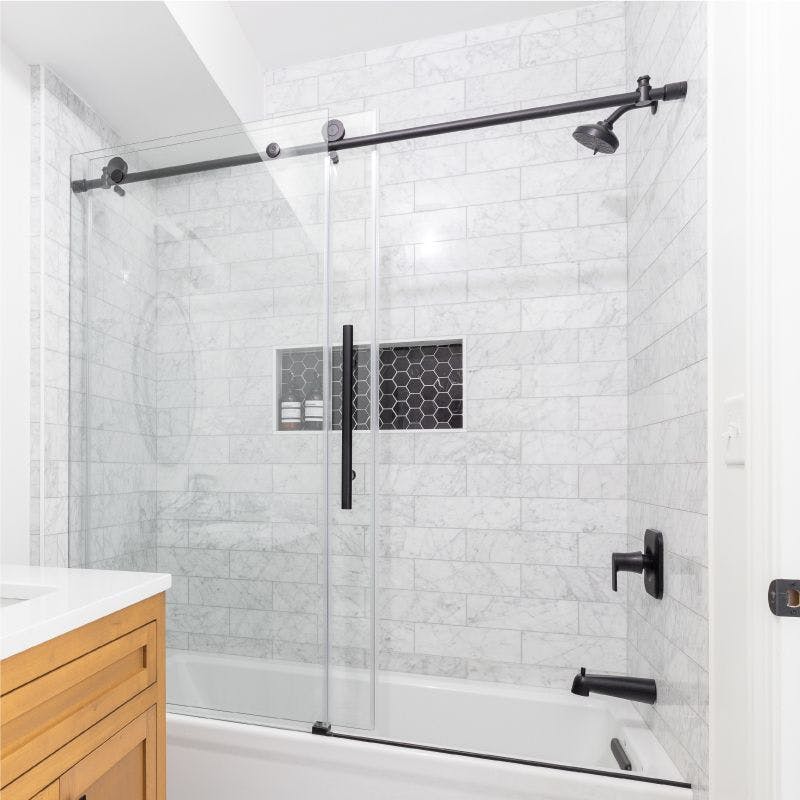 Bathroom with sliding glass shower door and sink