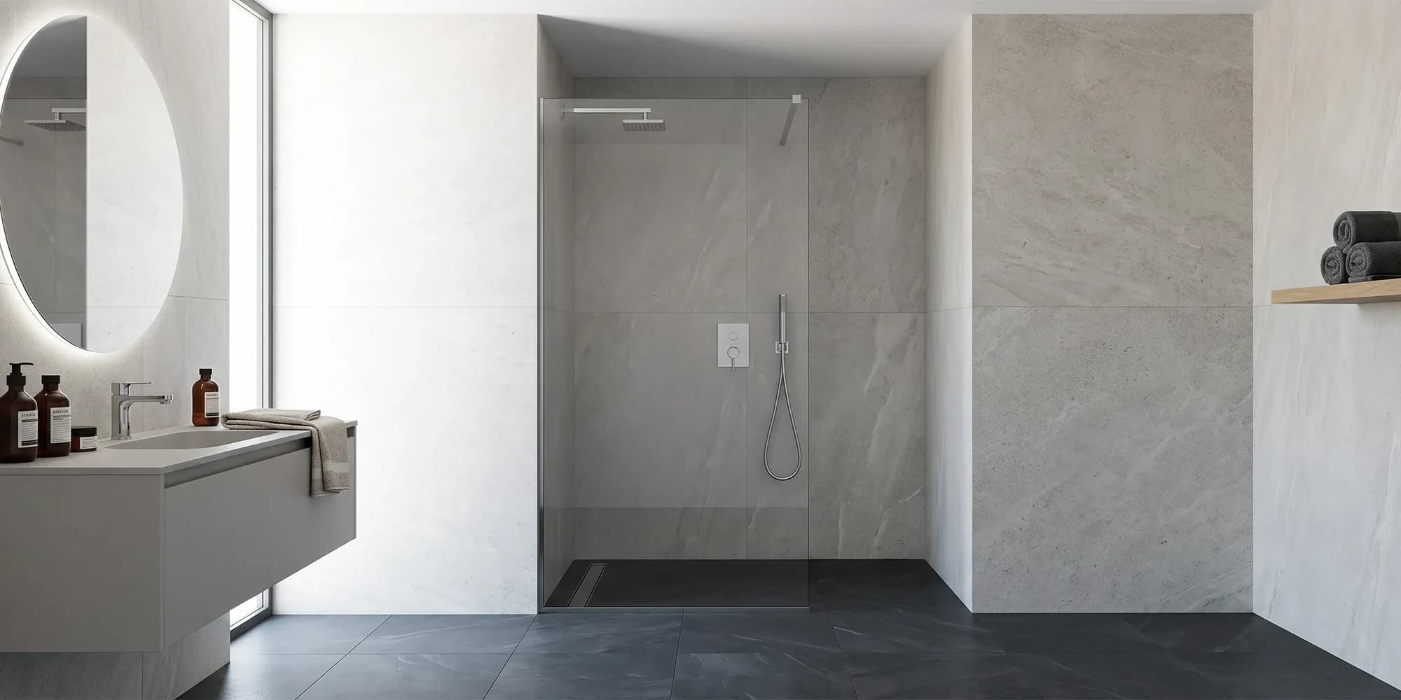 A fixed shower screen in a walk-in shower, sized to cover most of the opening