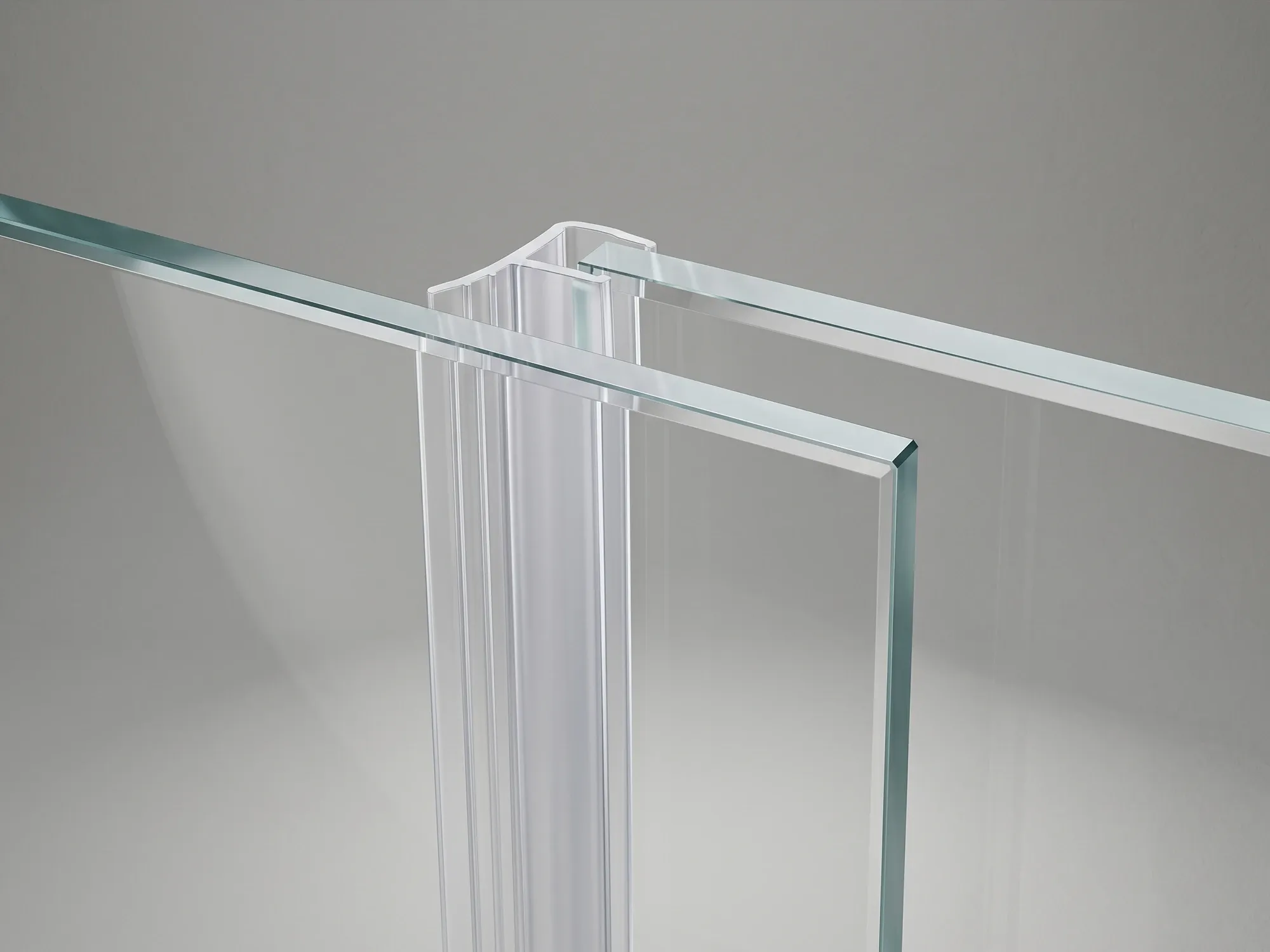 Vertical vinyl seal along the edge of a sliding shower door panel where it overlaps the adjacent panel