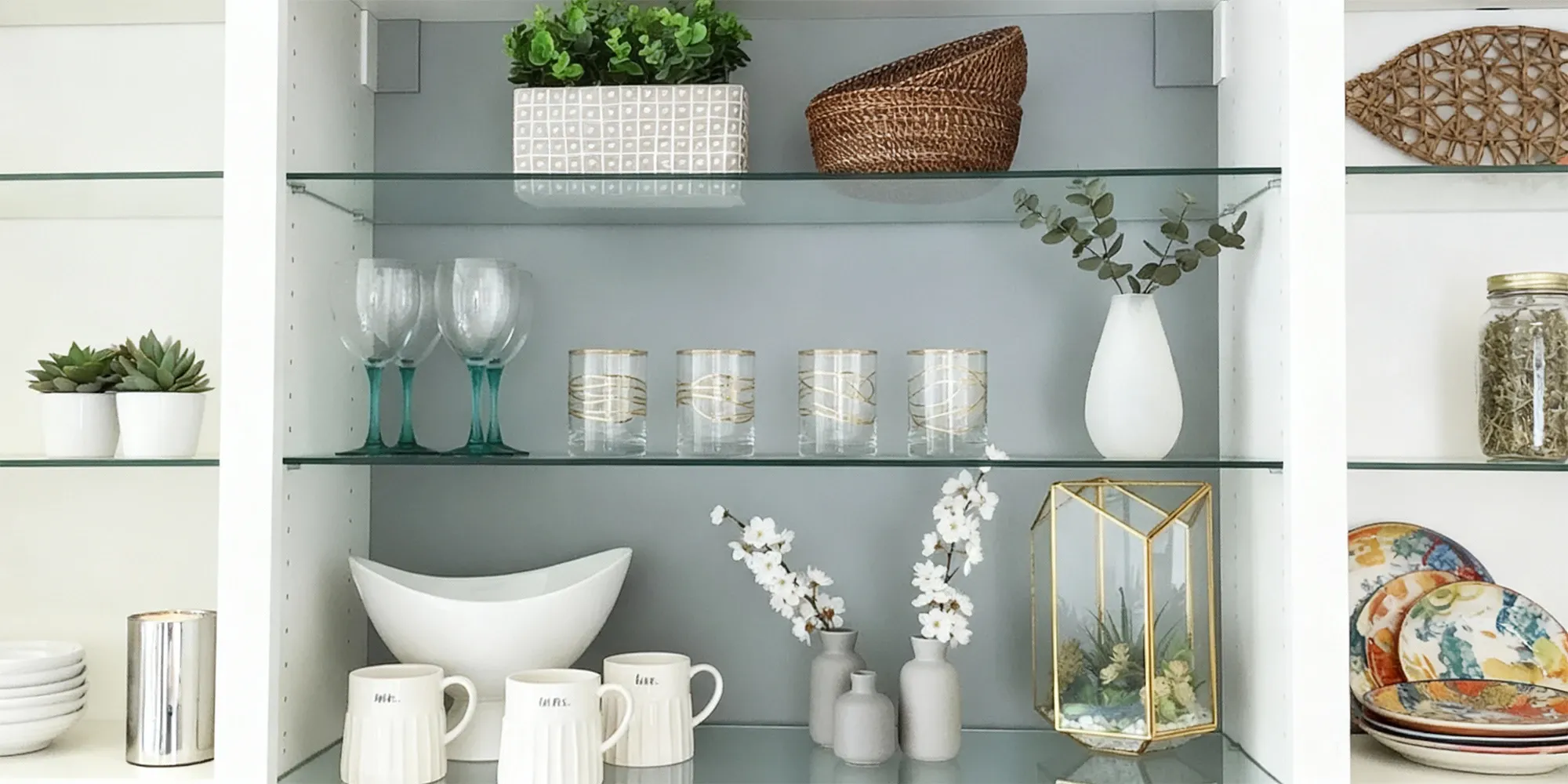 Glass shelves with decorative vases