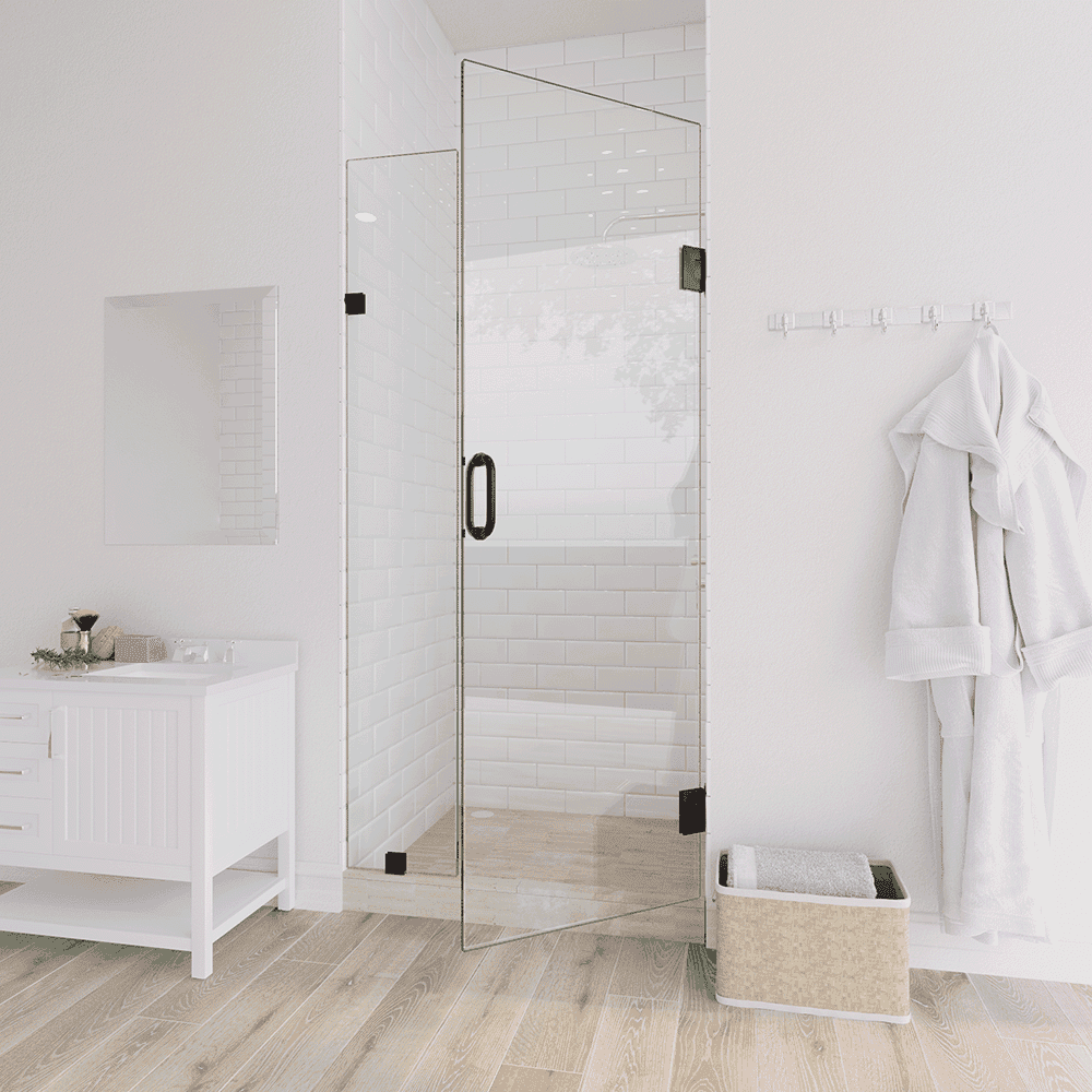 Minimalist bathroom design featuring a frameless glass door, white subway tiles, and light wooden flooring, creating a bright and clean aesthetic.