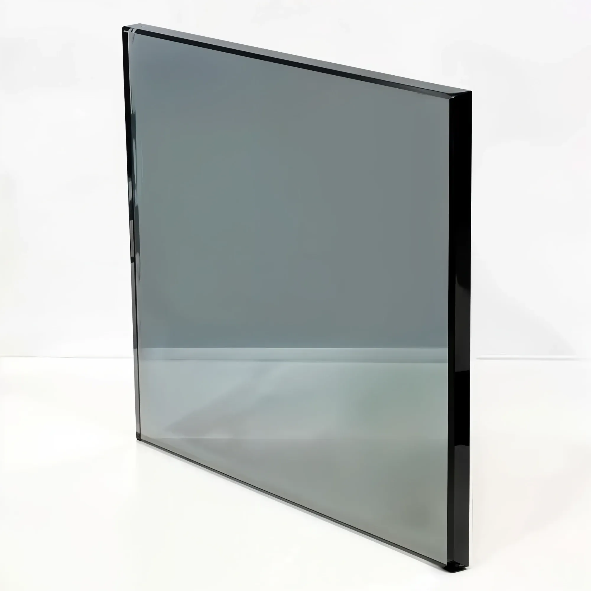 A sample of a sleek grey tinted glass panel, showing its smoky, semi-transparent quality and polished edges.
