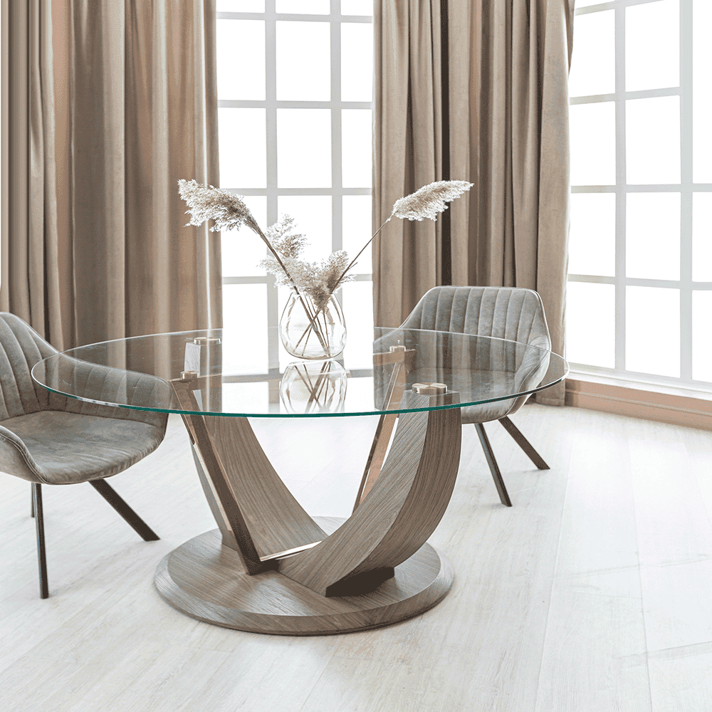 Custom glass tabletop featuring a modern design, complemented by stylish chairs and natural decor, ideal for enhancing interiors with tempered and beveled glass elements.
