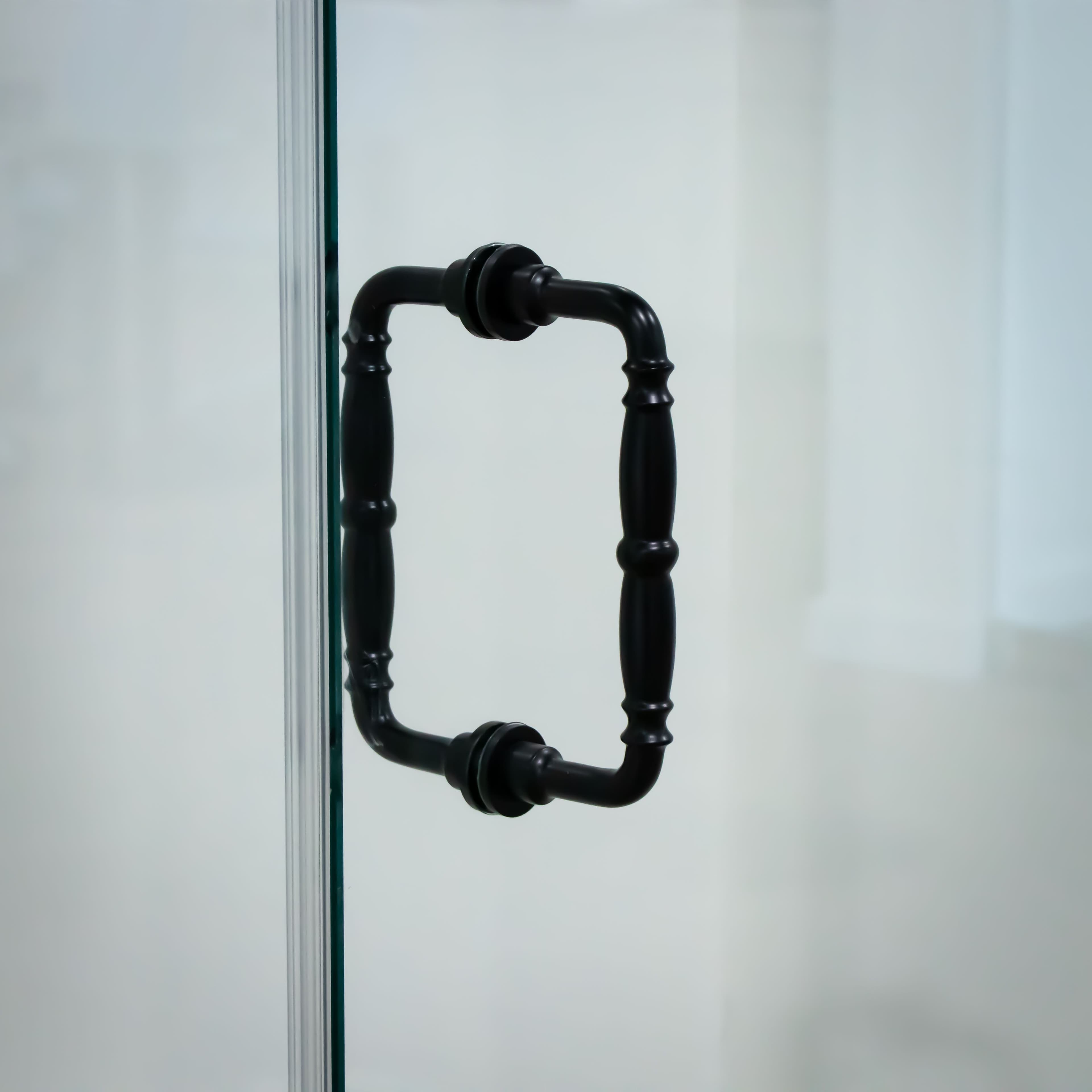 Close-up of a black decorative handle on a shower door made of custom tempered glass, highlighting stylish design for modern interiors.