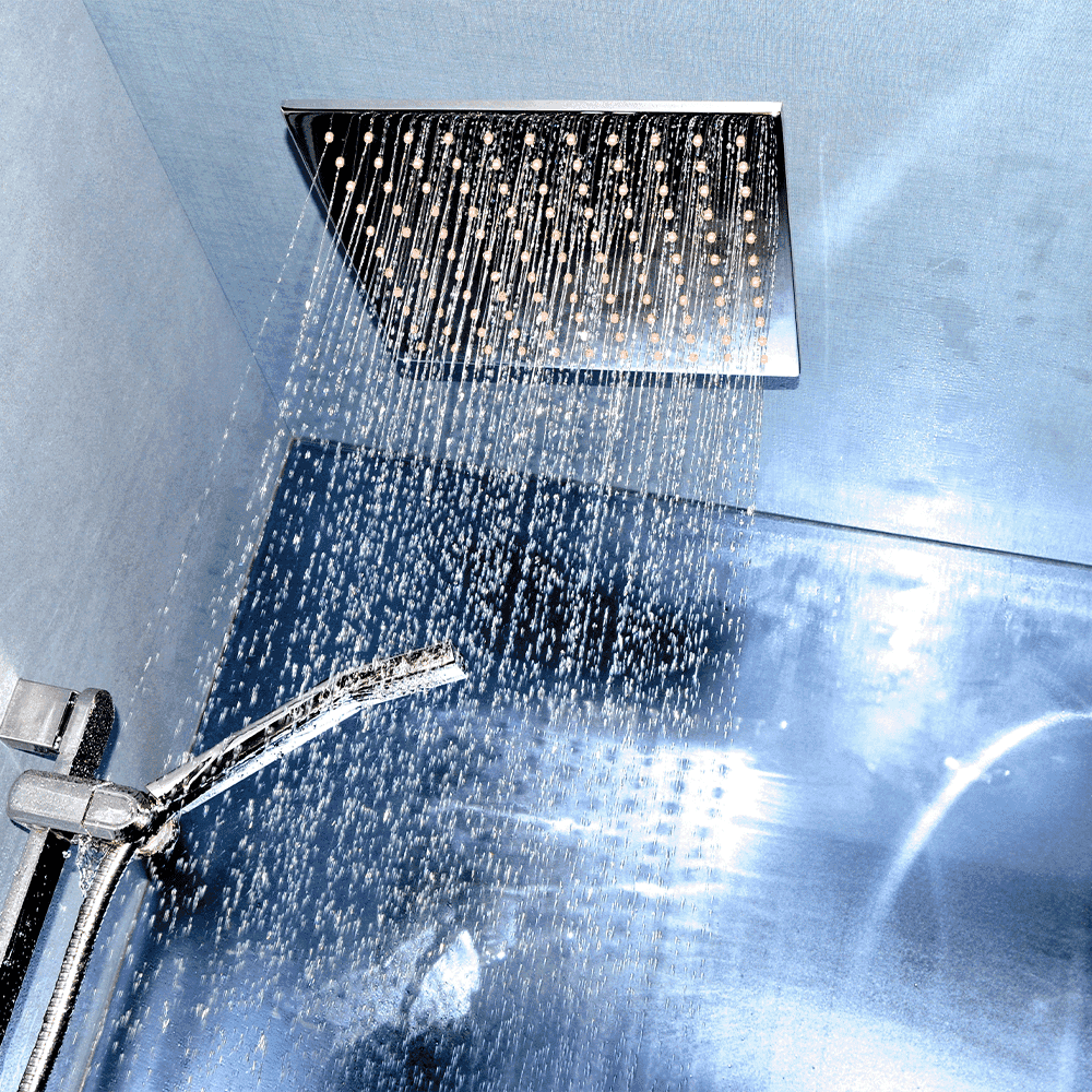 Luxury shower experience featuring a stylish rain showerhead with water cascading down, highlighting custom glass design elements for modern bathrooms.
