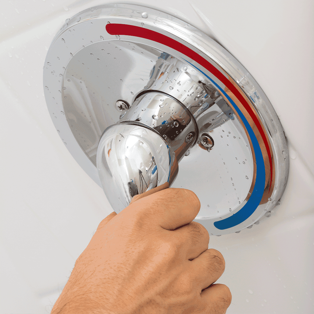 Hand adjusting a shower handle with water droplets, highlighting custom glass solutions such as shower doors and tempered glass for modern bathrooms.