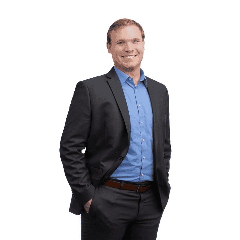 Professional man in a suit, representing custom glass solutions including shower doors, table tops, mirrors, tempered glass, and beveled glass edges.