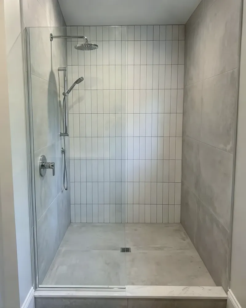 DIY fixed shower screen project showing a finished open shower layout