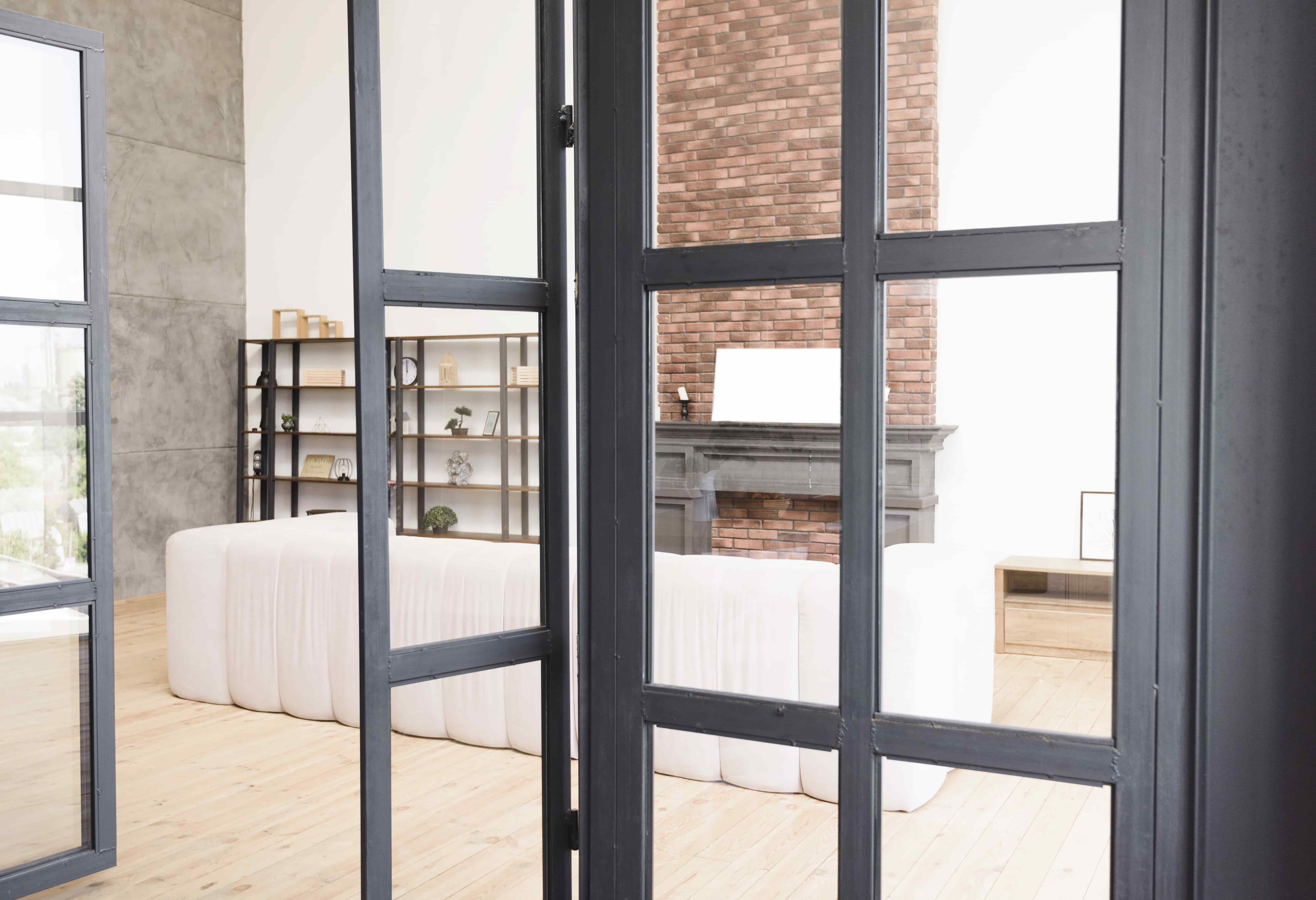 Interior view showcasing custom glass doors, emphasizing modern design elements, with features suitable for shower doors and mirrors in a stylish setting.