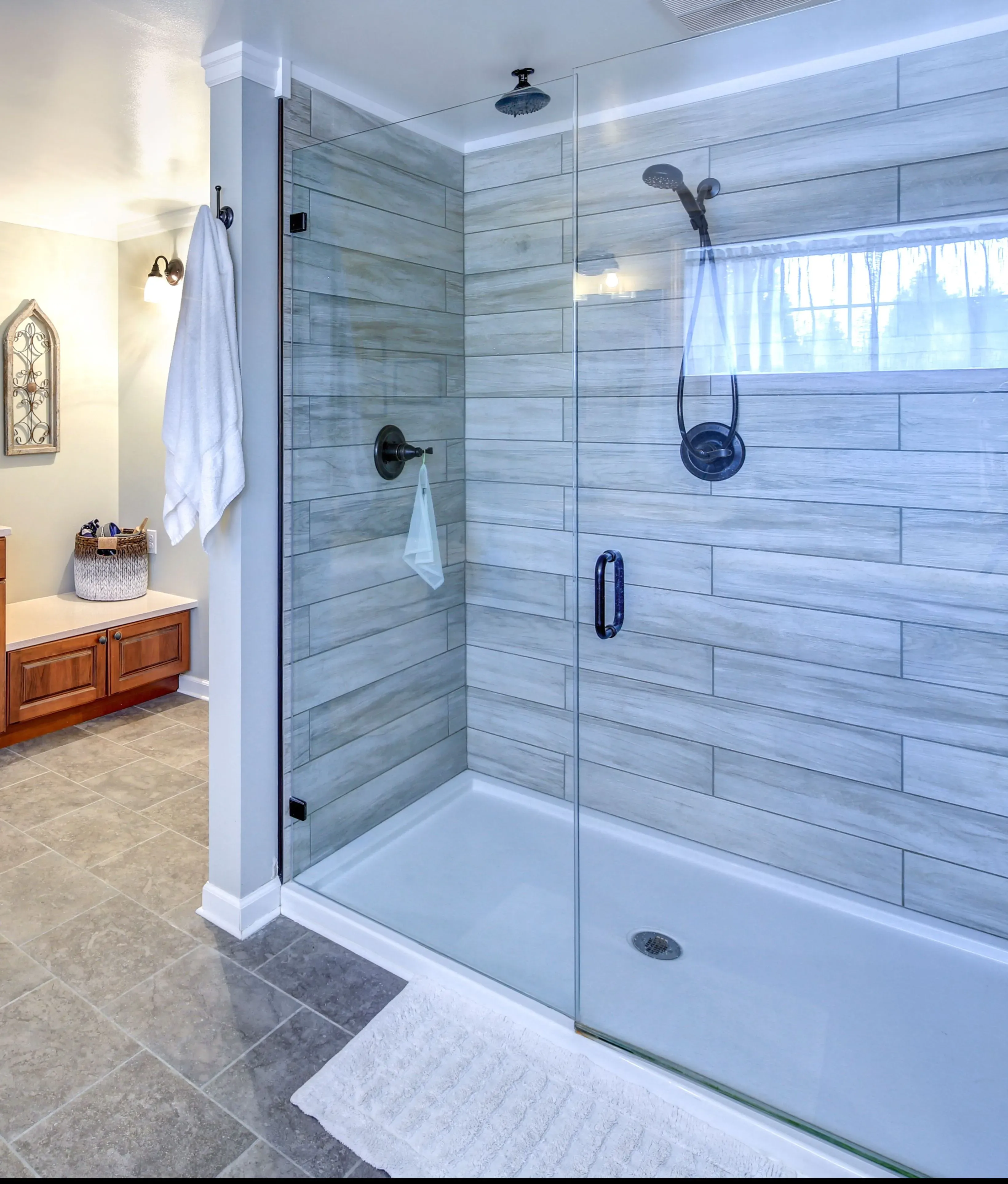 Custom glass shower doors featuring a sleek design, ideal for modern bathrooms with tempered glass construction and a sophisticated finish.