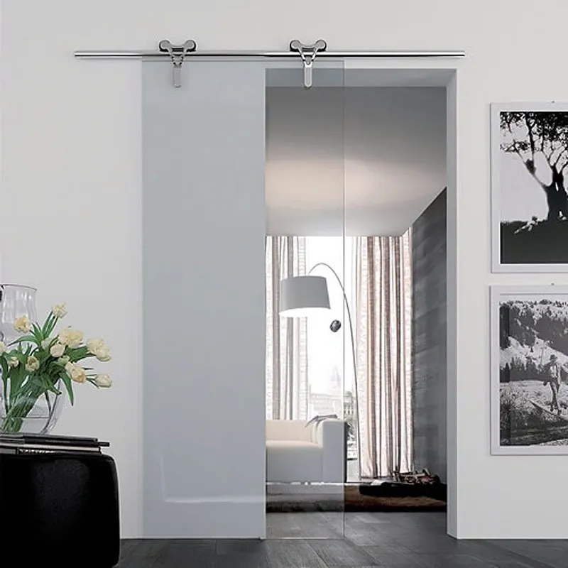Sliding glass shower door with sleek modern design, featuring tempered glass for safety, ideal for custom glass solutions, enhancing spaces alongside mirrors and table tops.