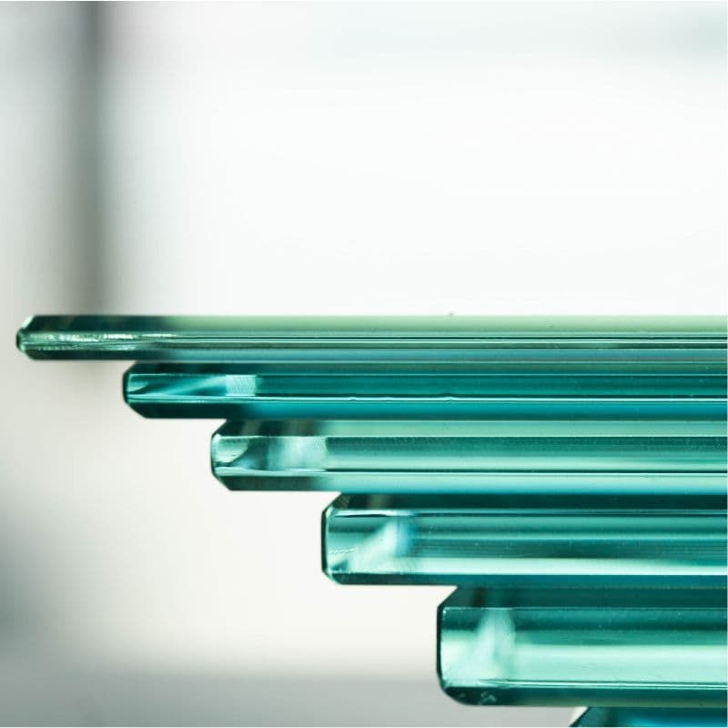 Close-up of custom glass table top featuring a beveled glass edge, showcasing quality tempered glass suitable for modern interiors.