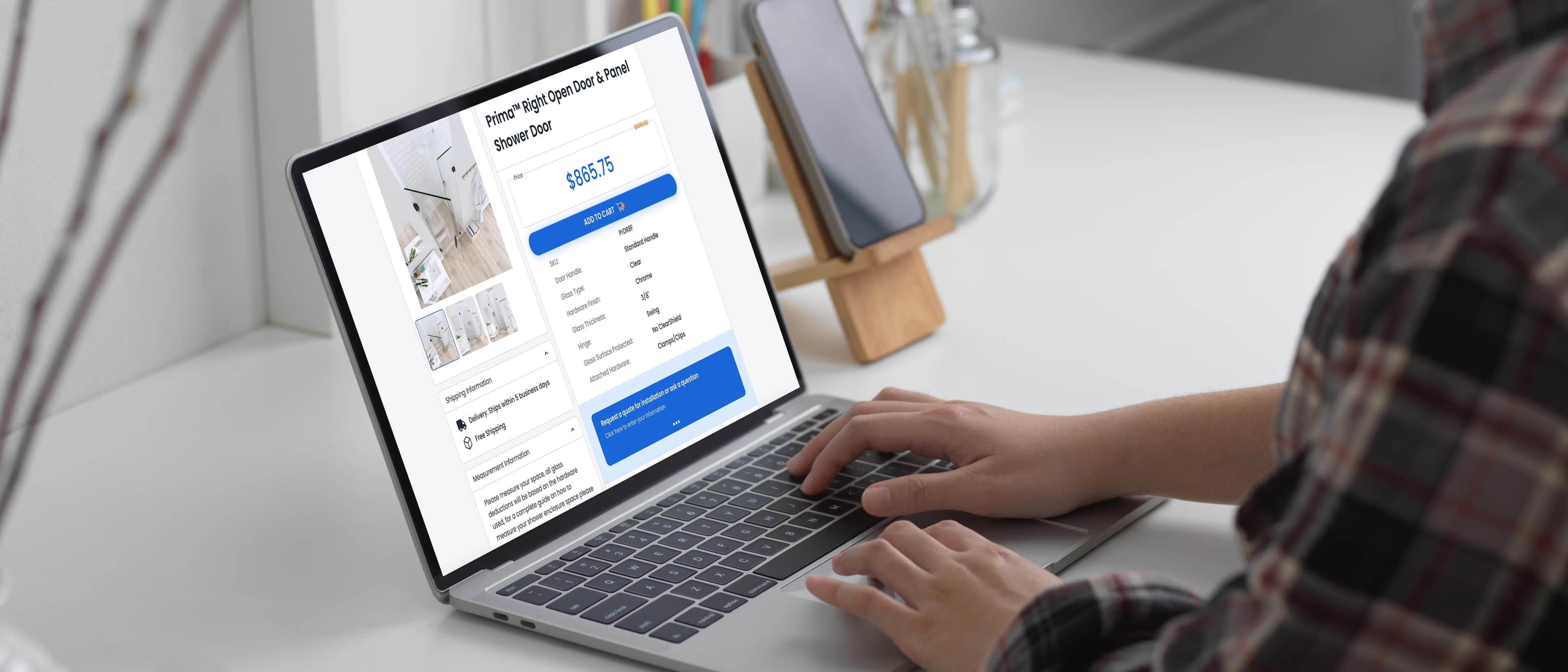 A person browsing a website for custom glass products, including shower doors, tempered glass, and beveled glass edge options, on a laptop.