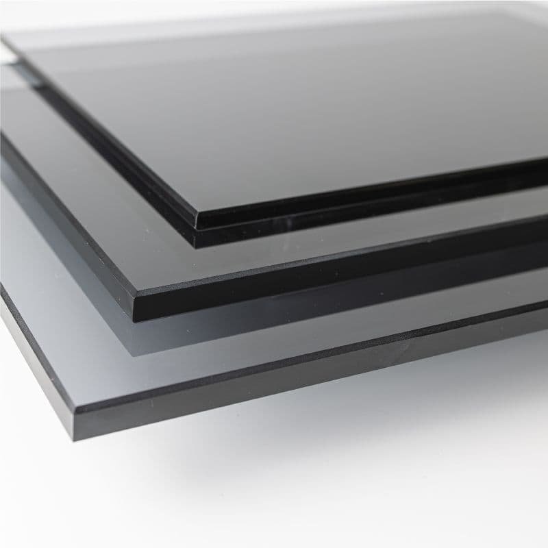 Stack of custom tempered glass sheets with beveled edges, suitable for shower doors, table tops, and mirrors.