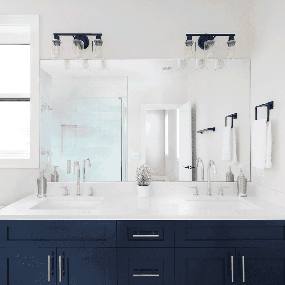 Modern bathroom featuring a large beveled edge mirror