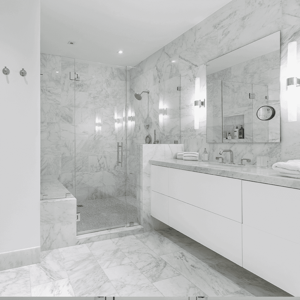 Modern bathroom featuring custom glass shower doors